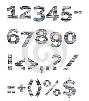 Numbers and symbols are composed of decorative stones. Alphabet from stone letters.