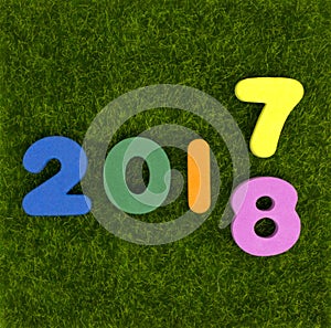 Numeral 2017 - 2018 on green grass