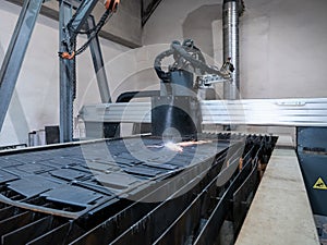 Numeric CNC plasma cutter, cuts metal parts from sheet of steel