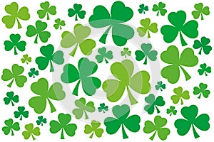 Numerous shamrocks, green three-leaf clover background