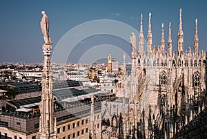 Numerous steeples with statues on Duomo di Milano main Cathedral photo