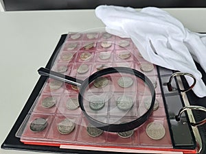 Numismatics. Old collectible coins made of silver on wooden table