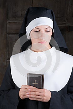 Nun with Bible