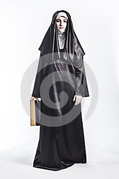 Nun with bible.