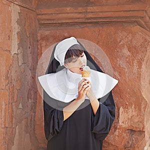 Nun eating ice cream