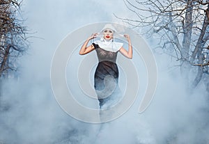 Nun in the smoke.