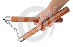 Nunchaku in a hand photo