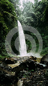 Nungnung waterfall on rainy day. Bali, Indonesia