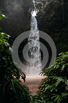 Nungnung Waterfall splashing in Bali Jungle, Indonesia