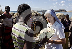 Nuns of Christian church buy handicrafts african tribe