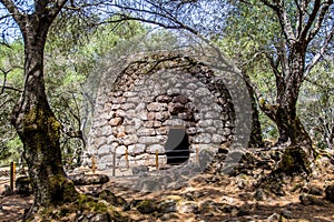 A nuraghe in the nuragic sanctuary of Santa Cristina, near Oristano, Sardinia, Italy photo