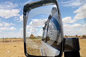 Nurbergen Kylyshev Mausoleum reflected in vehicle mirror