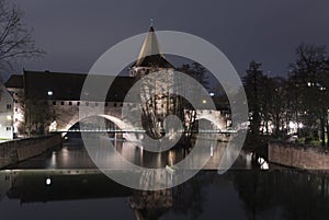 Nuremberg. Bridge over  Pegnitz River and Water tower in night, German