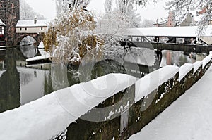 Nuremberg, Germany - Executioner house and footbridge - river Pegnitz- white winter