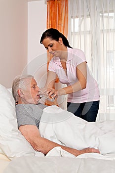 Nurse in aged care for the elderly in nursing photo