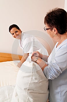 Nurse in aged care for the elderly in nursing photo