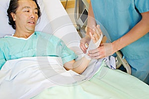 Nurse applying tensor to wrist
