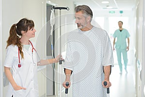 Nurse assisting patient