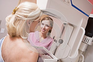 Nurse Assisting Patient Undergoing Mammogram photo