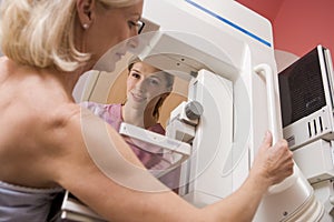 Nurse Assisting Patient Undergoing Mammogram