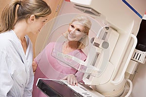 Nurse Assisting Patient Undergoing Mammogram photo