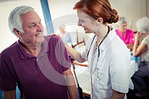 Nurse assisting a senior