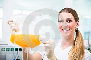 Nurse at blood donation service with plasma donation