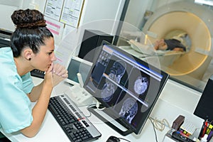 nurse checking screen mri results