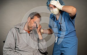 Nurse comforts a sick older man