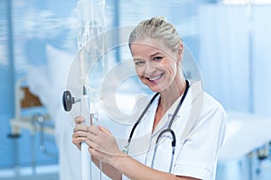 Nurse connecting an intravenous drip