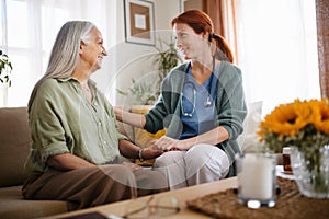 Nurse cosulting with senior her health condition.