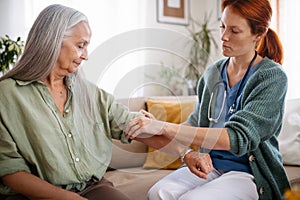 Nurse cosulting with senior her health condition.