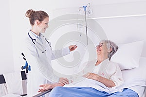 Nurse or doctor checking a drip on a patient