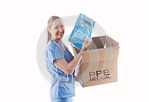Nurse or doctor holding a Category 3 Coverall PPE for infection control photo