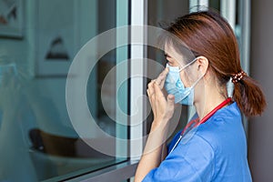 Nurse Doctor medical staff check tightness fit air leak seal of wearing the mask for safety Covid protection photo