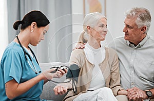 Nurse, doctor or old couple with blood pressure test consulting in hospital to monitor heart wellness. Healthcare