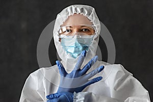 Nurse or doctor in personal protective equipment PPE due to COVID-19 coronavirus