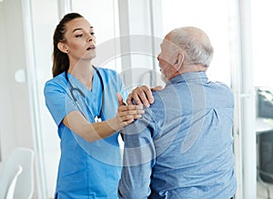 nurse doctor senior care caregiver help assistence retirement home pain back ache shoulder
