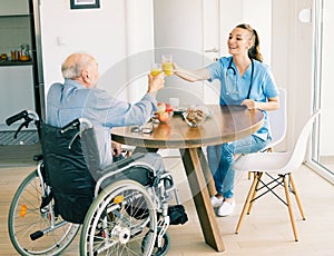 nurse doctor senior care caregiver help assistence wheelchair retirement home nursing elderly man