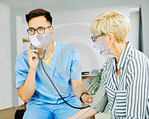 nurse doctor senior care caregiver help check exam blood pressure check pulse retirement home stethoscope nursing