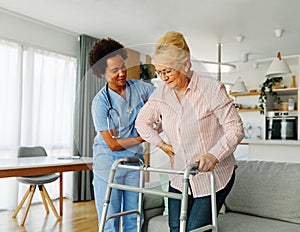 nurse doctor senior care caregiver help walker assistence retirement home nursing elderly woman black african american