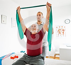 nurse doctor senior care exercise physical therapy exercising help assistence retirement home physiotherapy strech band