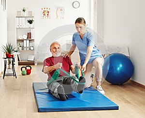 nurse doctor senior care exercise physical therapy exercising help assistence retirement home physiotherapy strech band