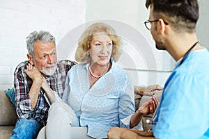 nurse doctor senior couple care caregiver help assistence retirement home nursing elderly man woman insurance