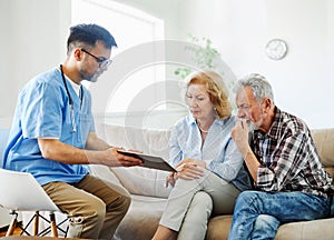 nurse doctor senior couple care caregiver help assistence retirement home nursing elderly man woman tablet technology