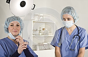 Nurse and Doctor in surgery with syringe