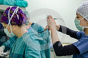 The nurse or doctor is wearing sterile surgical gown preoperative photo