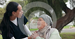 Nurse, elderly care and talking to patient on wheelchair in nature, support or trust in assisted living at park. Female