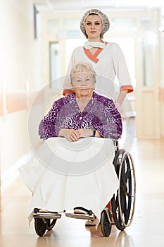 Nurse with elderly patient in wheelchair