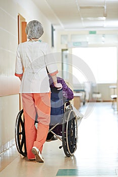 Nurse with elderly patient in wheelchair